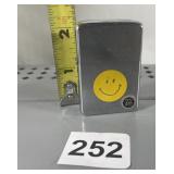 ZIPPO METAL LIGHTER, SMILEY FACE DECAL, MODEL