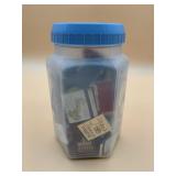 PLASTIC JAR FILLED W/ ASSORTED VTG MATCHBOOKS,