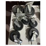 7 HEAVY DUTY RUBBER SWIVEL CASTERS W/ METAL