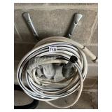 GARDEN HOSE W/ WALL MOUNTS.