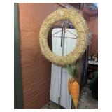 STRAW WREATH W/ (2) WOVEN CARROT DECORATIONS.