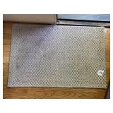 WOVEN TEXTURED AREA RUG, NEUTRAL TONE.