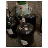 GLASS CARBOY W/ AIRLOCK, FILLED W/ DARK LIQUID,