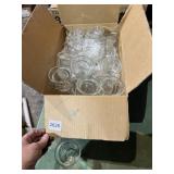 CLEAR GLASS VOTIVE HOLDERS (24+).