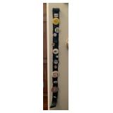ASSORTED NOVELTY BUTTONS AND PATCHES ON BLACK