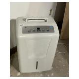 GE DEHUMIDIFIER W/ DRAIN HOSE.