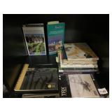ASSORTED TRAVEL GUIDES, SELF-HELP BOOKS, AND TRX