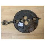 CAST IRON 8 INCH DAMPER, SPRING HANDLE.