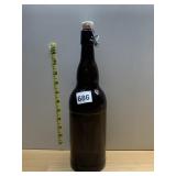 AMBER GLASS BOTTLE W/ SWING-TOP CLOSURE.
