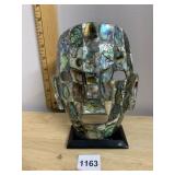 ABALONE SHELL MOSAIC MASK ON BLACK WOOD STAND.