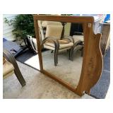 OAK WALL MIRROR W/ CARVED SHELL DETAIL.
