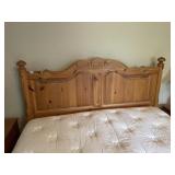 PINE HEADBOARD, CARVED SHELL AND FLORAL MOTIF,