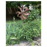 METAL WIND SPINNER W/ GLASS ORB CENTER.