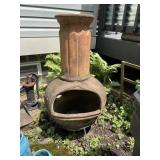 TERRACOTTA CHIMINEA W/ RIBBED COLUMN DESIGN.