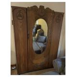 VTG OAK ARMOIRE, OVAL BEVELED MIRROR DOOR, CARVED