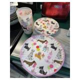 DOG THEMED PARTY PLATES AND FROSTED PLASTIC CUPS.