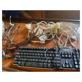 DELL KEYBOARD, ASSORTED POWER CORDS, RCA CABLES.