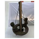METAL FIGURAL SCULPTURE, CHILDREN ON TIRE SWING,