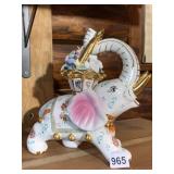 PORCELAIN ELEPHANT FIGURINE, BASKET OF FLOWERS,
