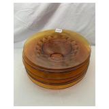 AMBER GLASS PLATES (4), CIRCULAR PATTERN, PRESSED