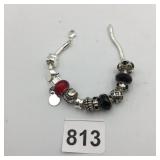 METAL CHARM BRACELET, SNAKE CHAIN, RED AND BLACK