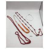 ASSORTED BEADED NECKLACES, RED AND ORANGE TONES,