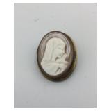 METAL CAMEO BROOCH, RELIGIOUS MOTIF, CARVED SHELL