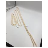 TWO LONG FAUX PEARL STRAND NECKLACES, ONE