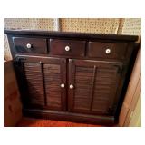 WOOD CABINET, THREE DRAWERS, TWO LOUVERED DOORS,