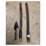 TWO MACHETES W/ WRAPPED HANDLES, ONE SMALL TROWEL