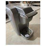 KEURIG COFFEE MAKER, SINGLE SERVE, SILVER FINISH.