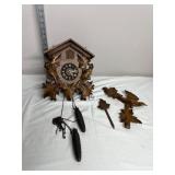 GERMAN CUCKOO CLOCK, CARVED WOODEN LEAF AND BIRD