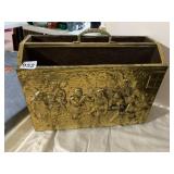 BRASS MAGAZINE RACK, EMBOSSED FIGURAL SCENE,