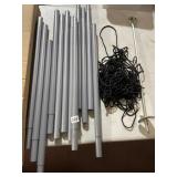 ASSORTED METAL POLES, INCLUDES BLACK ROPE, GROUND