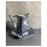 BLUE AND WHITE FLORAL PITCHER AND UNDERPLATE,