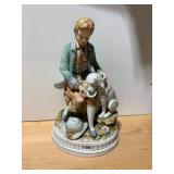 PORCELAIN FIGURINE, YOUTH FEEDING DOG,