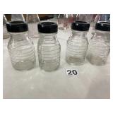 ASSORTED GLASS BOTTLES, GRADUATED MEASUREMENT