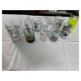 ASSORTED DRINKING GLASSES, NEWSPAPER PRINT,