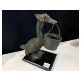 GOOSE FIGURINE, METAL, WEARING BONNET, CARRYING