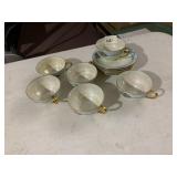 PORCELAIN TEA CUPS AND SAUCERS, IRIDESCENT
