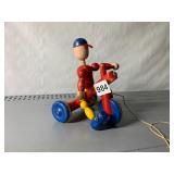 WOODEN PULL TOY, BOY ON TRICYCLE, HAND-PAINTED,