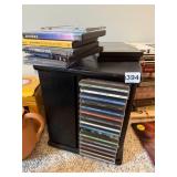 MEDIA STORAGE STAND, INCLUDES ASSORTED MUSIC CDS