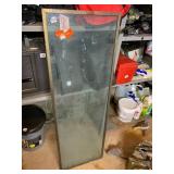 RECTANGULAR GLASS PANEL W/ METAL FRAME.