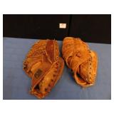 2 BASEBALL GLOVES; 1 GLOVE IS REVELATION