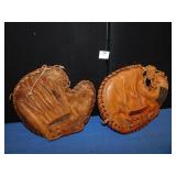 2 VINTAGE CATCHERS MITS. ONE GLOVE IS A WILSON.