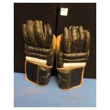 ONE PAIR OF VINTAGE SPALDING HOCKEY GLOVES.