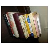 ARTIST TOTE AND STACK OF BOOKS