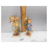 2 GOEBELS; KISS ME & GIRL HOLDING A POTTED FLOWER