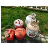 THREE GAS CANS AND TWO PROPANE