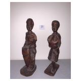 Two carved African figures Signed Pierre